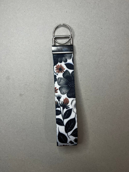 Bold. Minimal. Beautiful Black Flower Wristlet Keychain